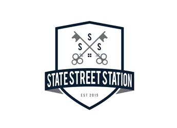 apartment logo design concept with crossed keys inside shield outline