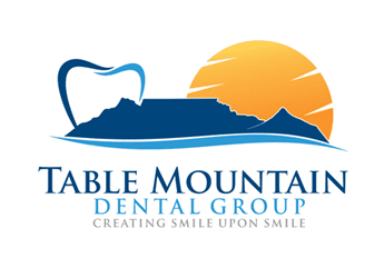 abstract tooth and sun behind mountain concept for dental logo design
